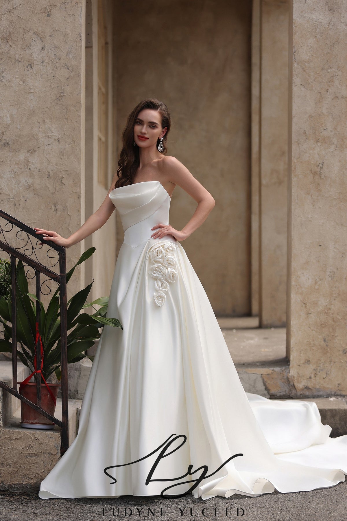 Strapless Satin Wedding Dress with Draped Bodice and Floral Accent