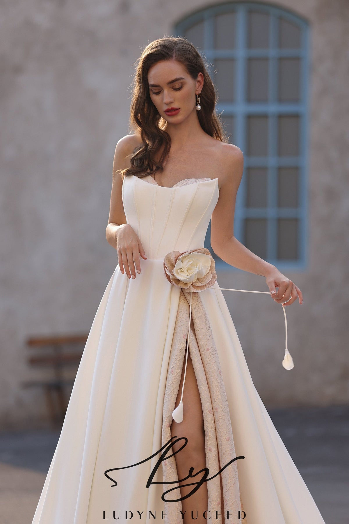 Elegant Strapless Satin Wedding Dress with Floral Accent